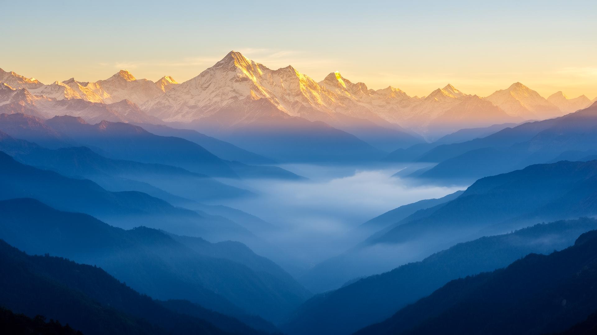 Himalayan sunrise over a misty valley